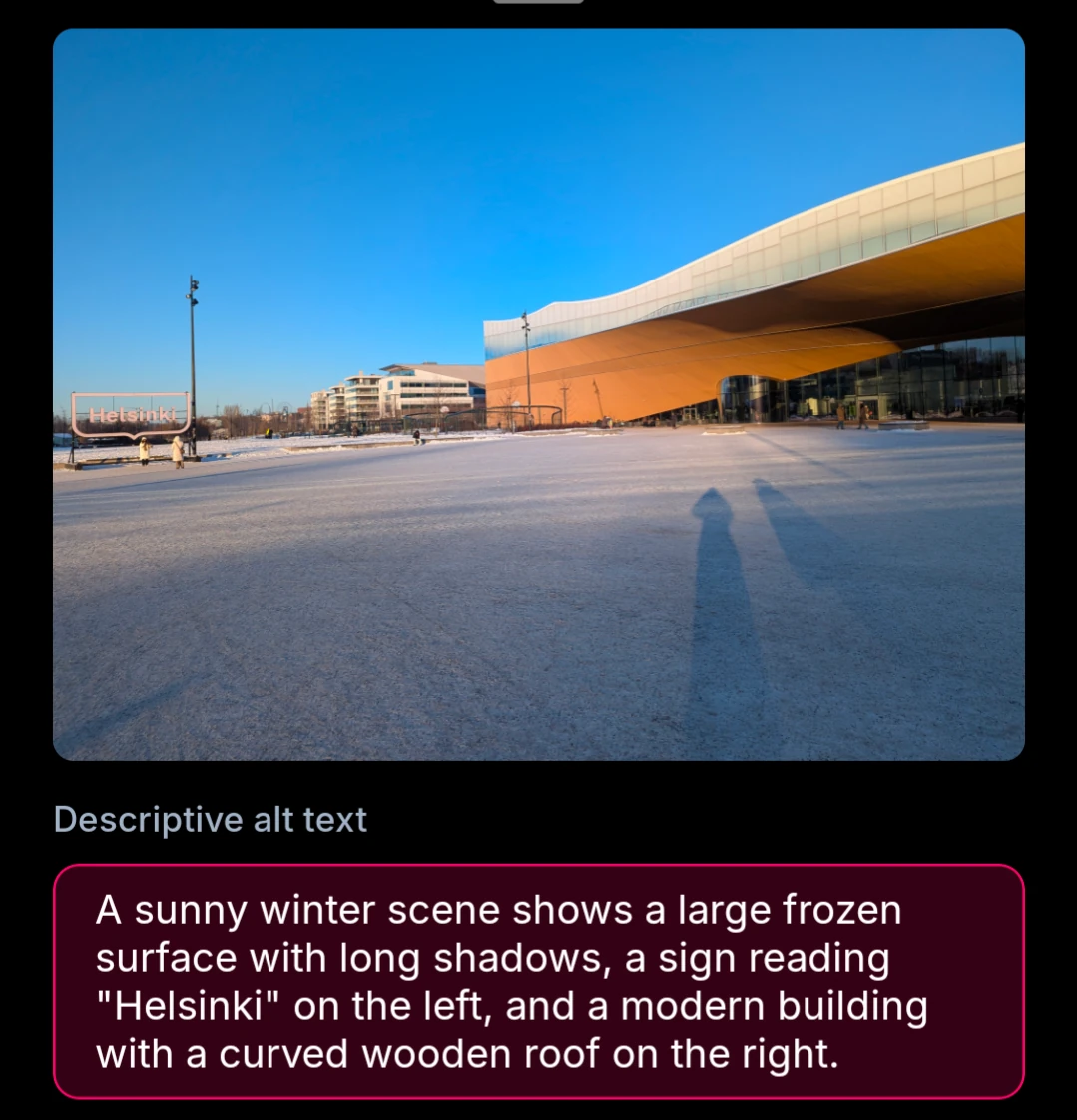 A sunny winter scene shows a large frozen surface with long shadows, a sign reading "Helsinki" on the left, and a modern building with a curved wooden roof on the right.