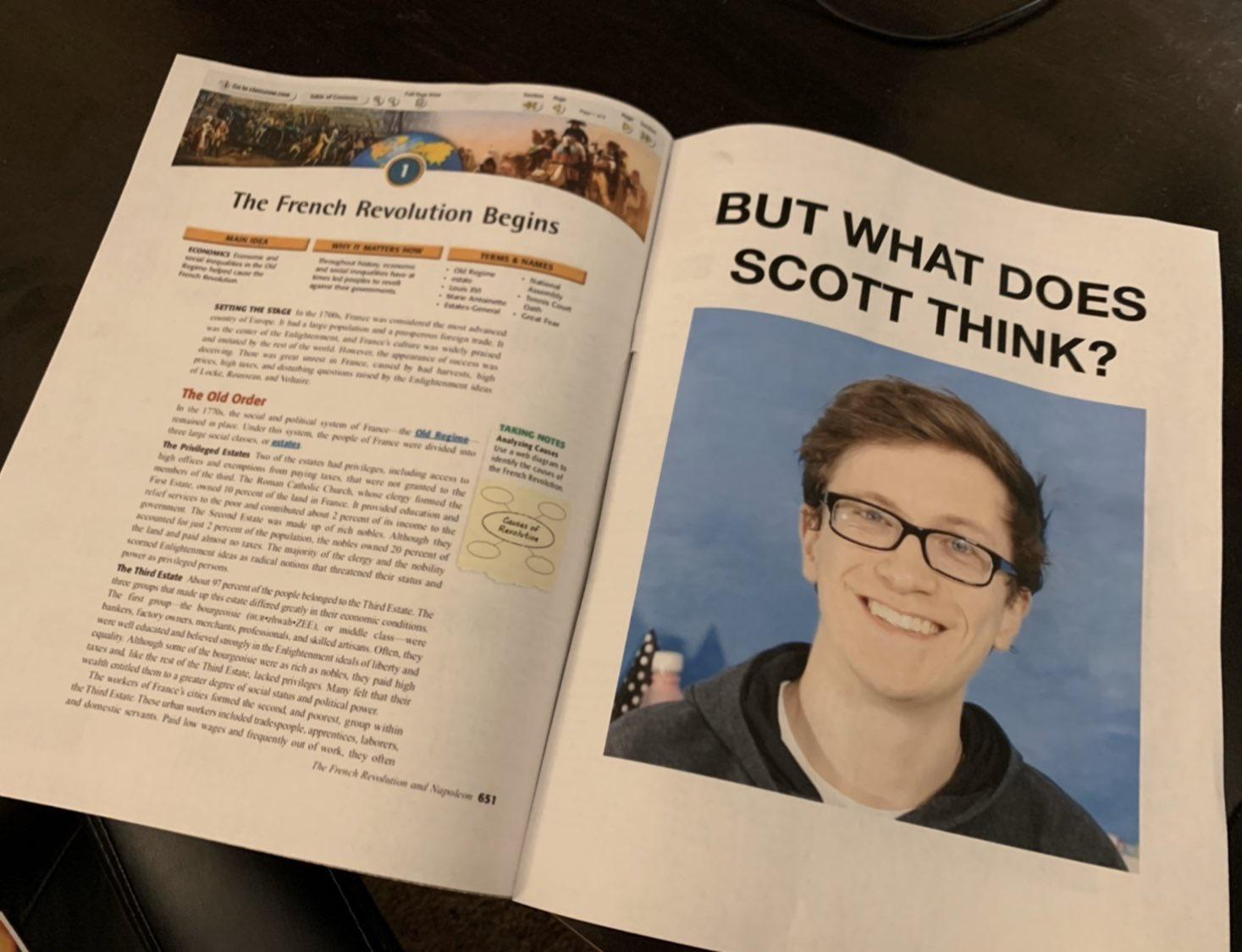 Book open to "The French Revolution Begins", next page has a US letter on it with a title of "But what does scott think?" and a picture of scott the woz